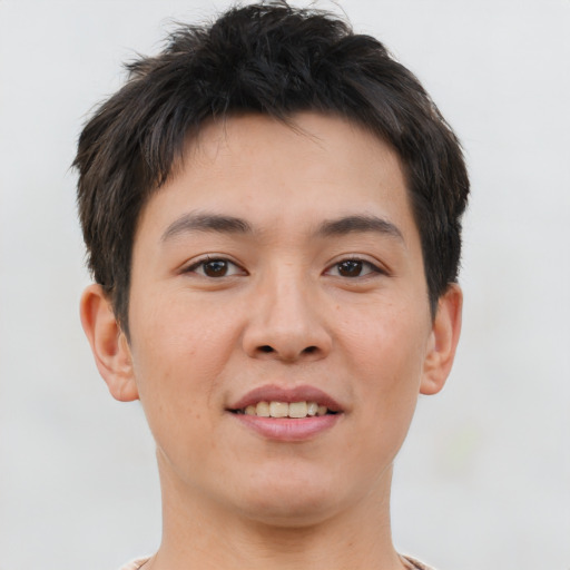 Joyful asian young-adult male with short  brown hair and brown eyes