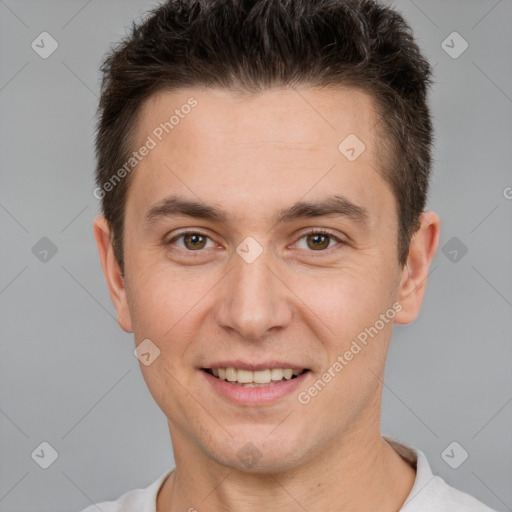 Joyful white young-adult male with short  brown hair and brown eyes