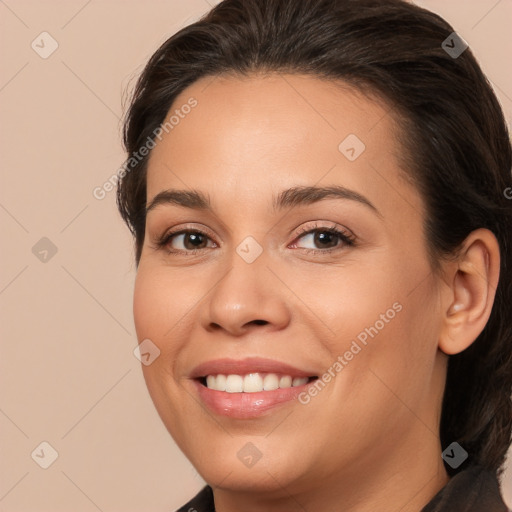 Joyful white young-adult female with medium  brown hair and brown eyes