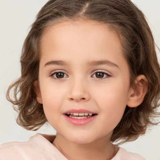 Joyful white child female with medium  brown hair and brown eyes