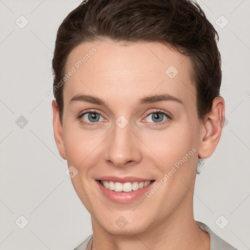 Joyful white young-adult female with short  brown hair and grey eyes