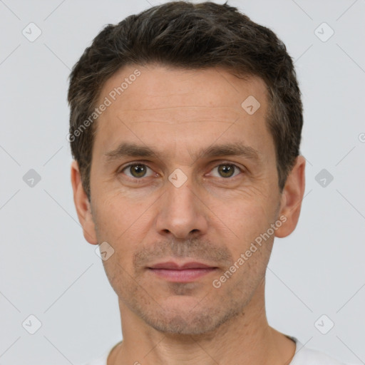 Joyful white adult male with short  brown hair and brown eyes