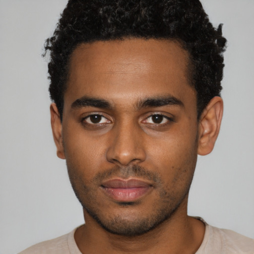 Neutral black young-adult male with short  black hair and brown eyes