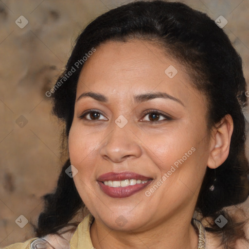 Joyful latino adult female with medium  brown hair and brown eyes