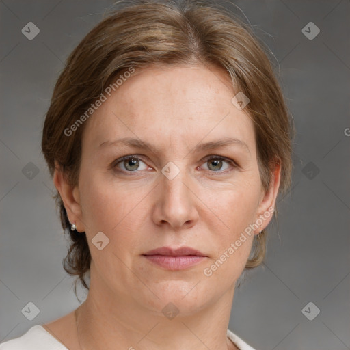 Joyful white adult female with medium  brown hair and grey eyes