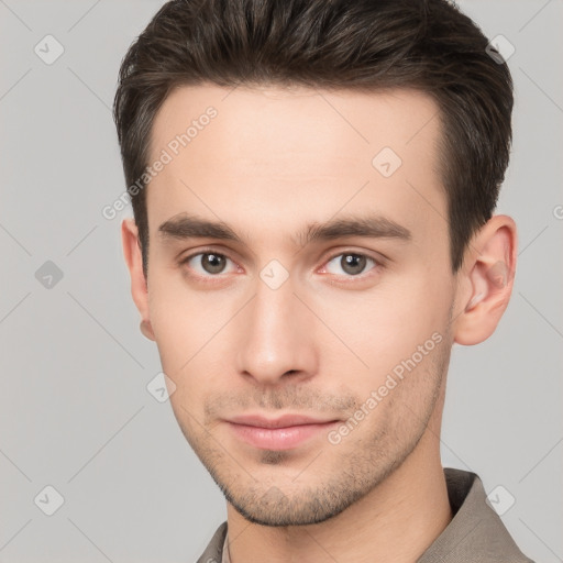 Neutral white young-adult male with short  brown hair and brown eyes