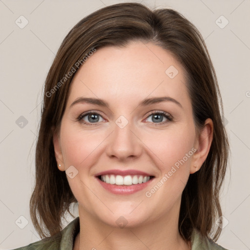 Joyful white young-adult female with medium  brown hair and green eyes