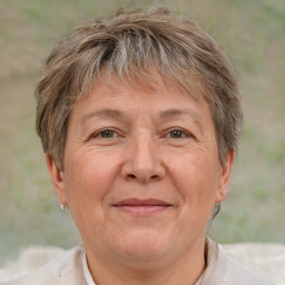 Joyful white middle-aged female with short  brown hair and brown eyes