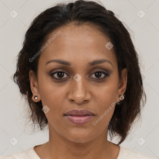 Joyful black young-adult female with medium  brown hair and brown eyes