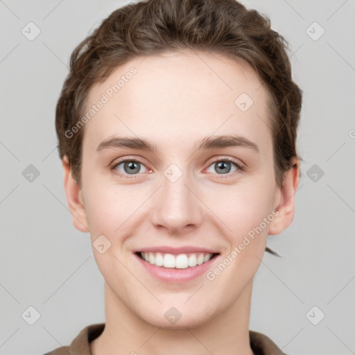 Joyful white young-adult female with short  brown hair and grey eyes