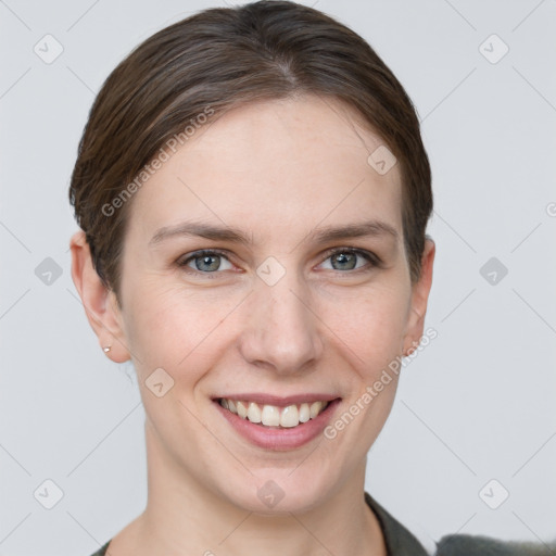 Joyful white young-adult female with short  brown hair and grey eyes