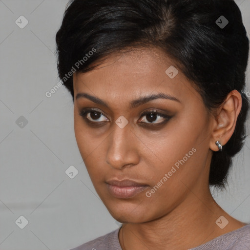 Neutral black young-adult female with medium  brown hair and brown eyes