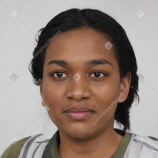 Joyful black young-adult female with short  black hair and brown eyes