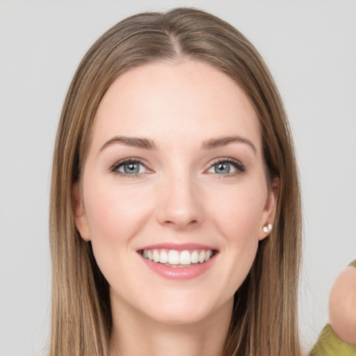 Joyful white young-adult female with long  brown hair and grey eyes