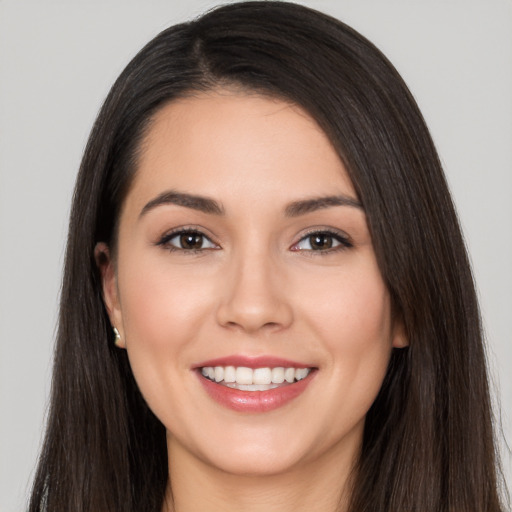 Joyful white young-adult female with long  black hair and brown eyes