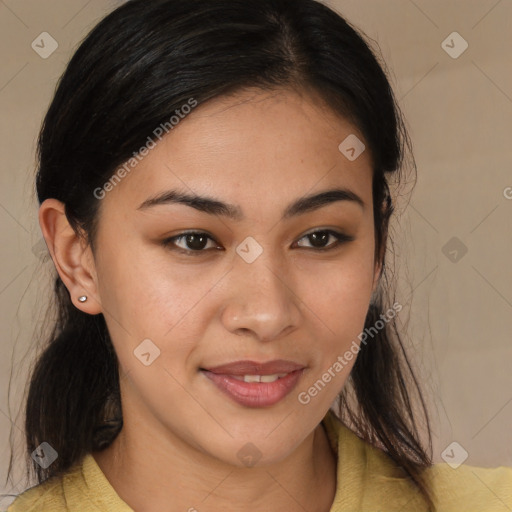 Joyful latino young-adult female with medium  brown hair and brown eyes