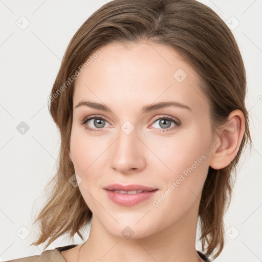 Joyful white young-adult female with medium  brown hair and blue eyes