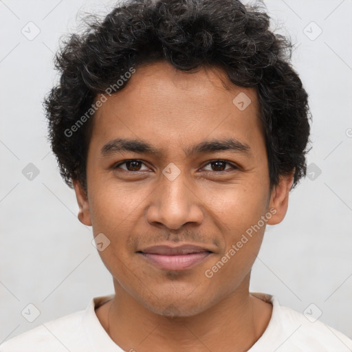 Joyful latino young-adult male with short  brown hair and brown eyes