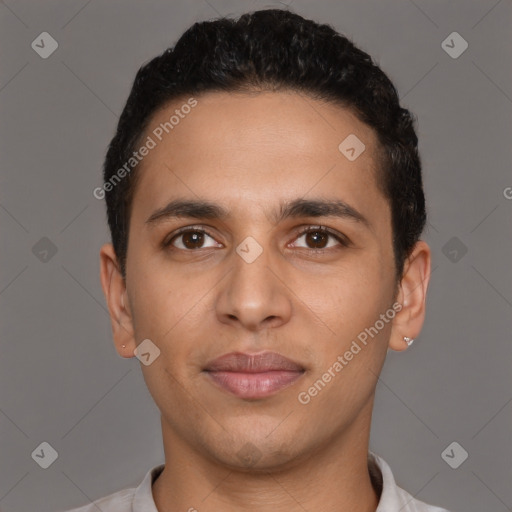 Joyful latino young-adult male with short  brown hair and brown eyes