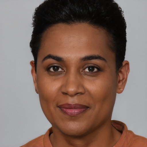 Joyful latino young-adult female with short  brown hair and brown eyes
