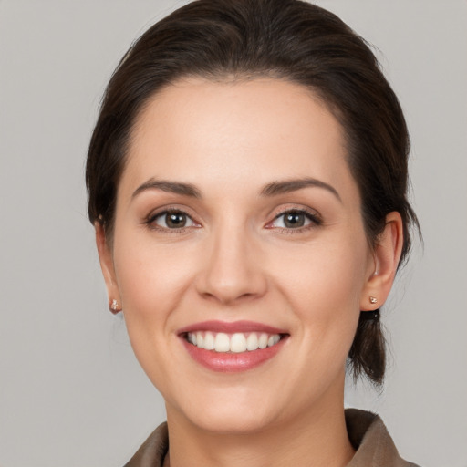 Joyful white young-adult female with medium  brown hair and brown eyes