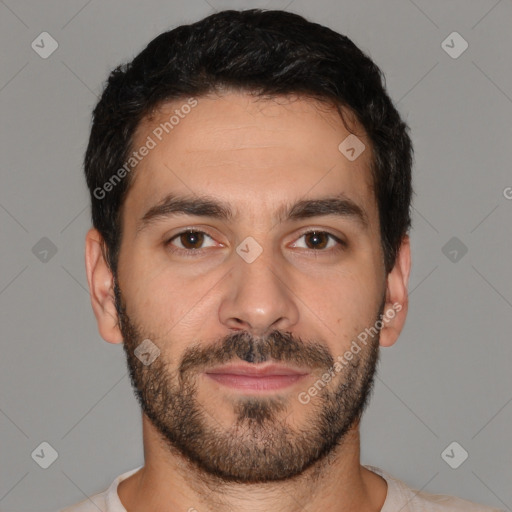 Joyful white young-adult male with short  black hair and brown eyes