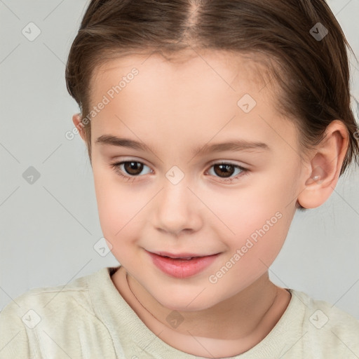 Joyful white child female with short  brown hair and brown eyes