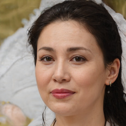 Joyful white adult female with medium  brown hair and brown eyes