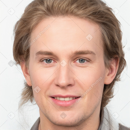 Joyful white young-adult male with medium  brown hair and brown eyes