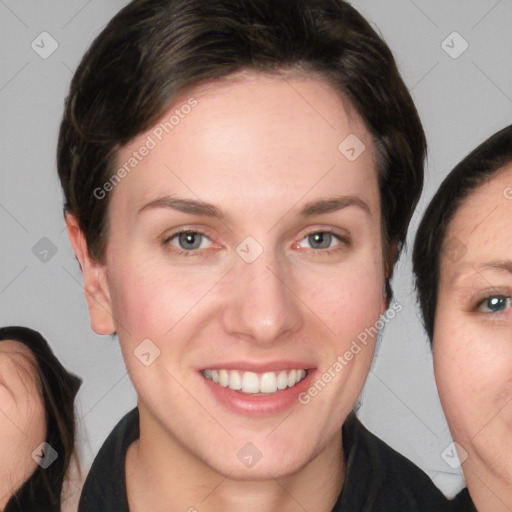 Joyful white young-adult female with medium  brown hair and grey eyes