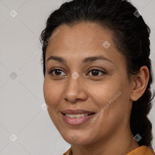 Joyful black young-adult female with medium  brown hair and brown eyes