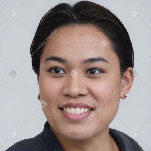 Joyful asian young-adult female with medium  brown hair and brown eyes