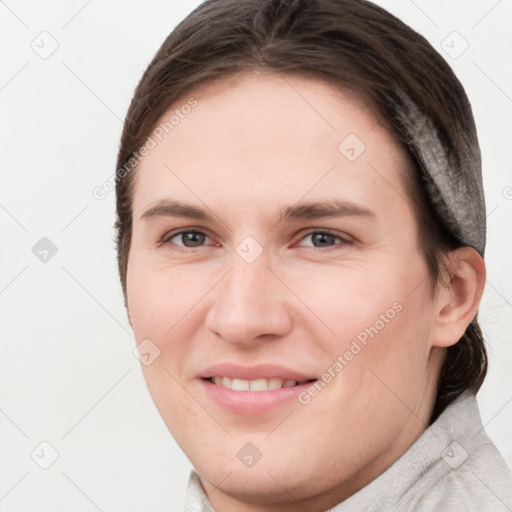 Joyful white young-adult female with short  brown hair and brown eyes