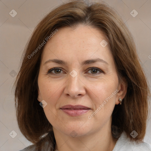 Joyful white adult female with medium  brown hair and brown eyes