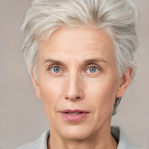 Neutral white adult female with short  blond hair and grey eyes