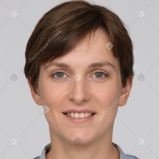 Joyful white young-adult female with short  brown hair and grey eyes