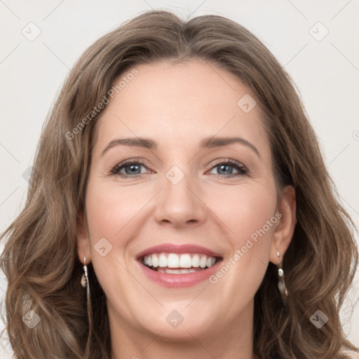 Joyful white young-adult female with long  brown hair and green eyes