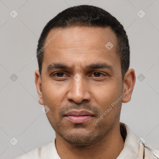 Neutral latino adult male with short  black hair and brown eyes