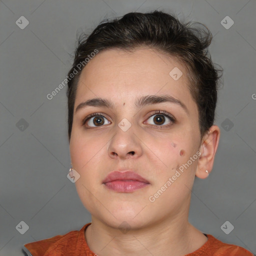 Neutral white young-adult female with short  brown hair and brown eyes