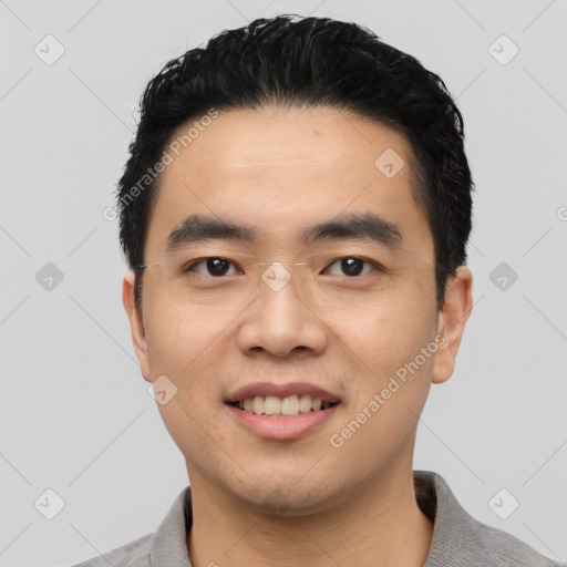 Joyful asian young-adult male with short  black hair and brown eyes