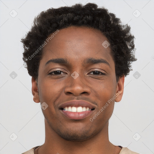 Joyful black young-adult male with short  brown hair and brown eyes