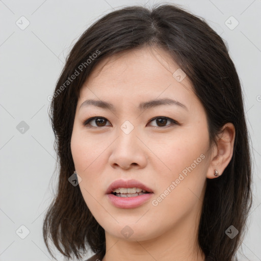 Joyful white young-adult female with long  brown hair and brown eyes