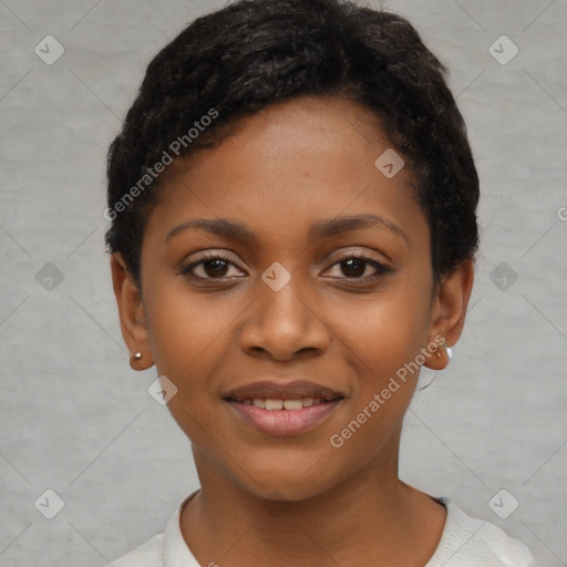 Joyful black young-adult female with short  black hair and brown eyes