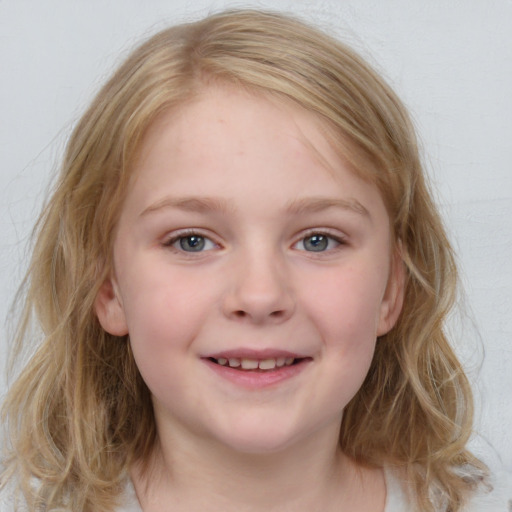 Joyful white child female with medium  brown hair and blue eyes