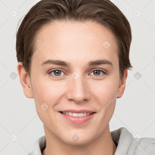 Joyful white young-adult female with short  brown hair and grey eyes