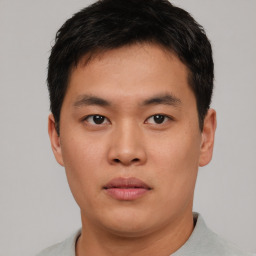 Neutral asian young-adult male with short  brown hair and brown eyes