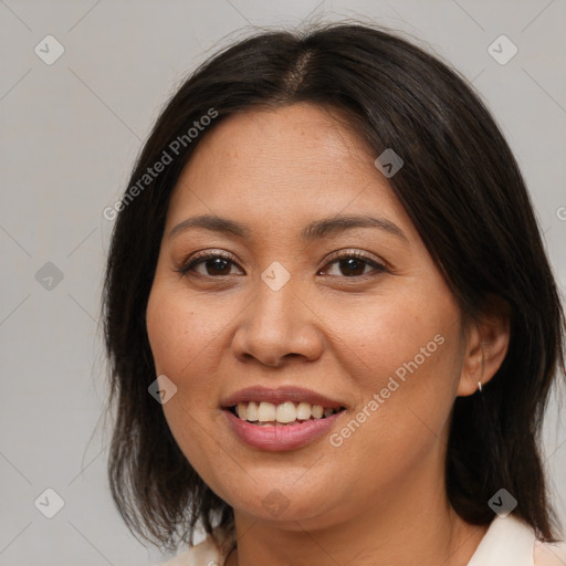 Joyful latino young-adult female with medium  brown hair and brown eyes