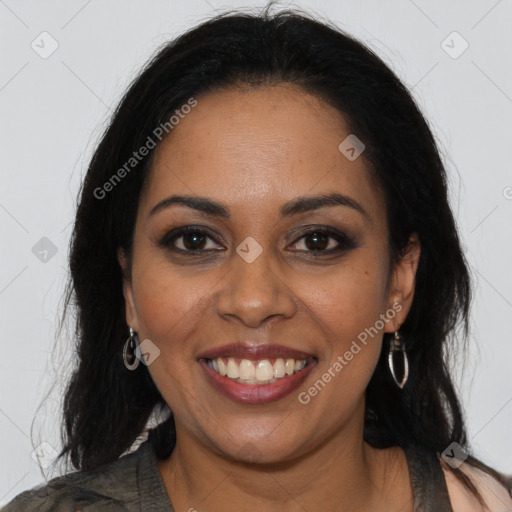 Joyful black young-adult female with long  brown hair and brown eyes