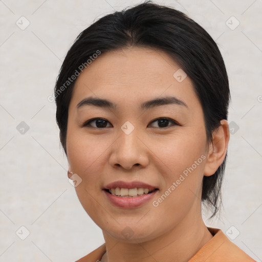 Joyful asian young-adult female with medium  black hair and brown eyes