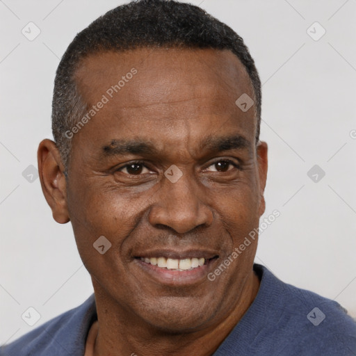 Joyful black adult male with short  brown hair and brown eyes